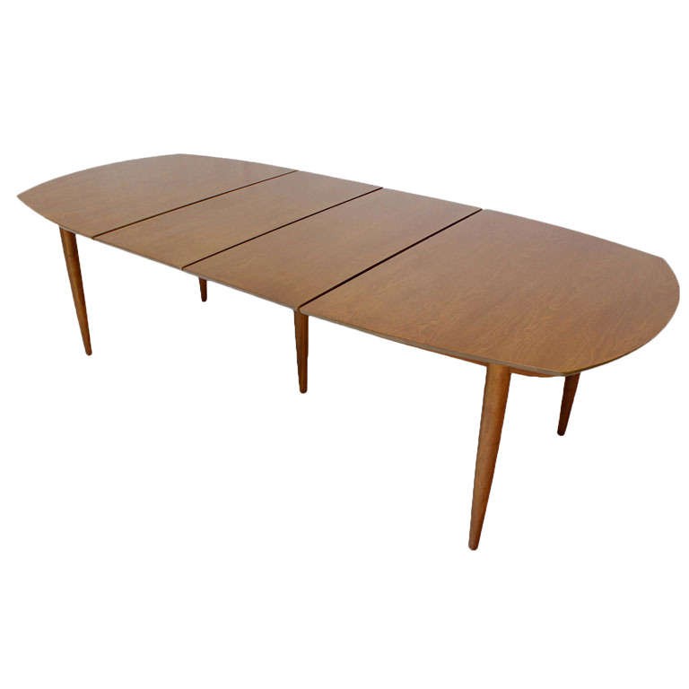 Oval walnut dining table