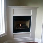 built-in-concrete-fireplace-design-with-white-mantel