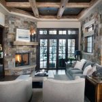 Rustic Stone With Wood Beams Corner Fireplace Design